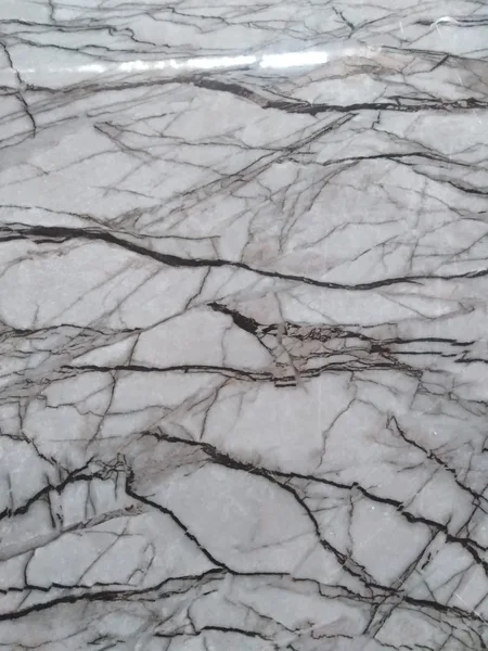 Marmol sintetico 1.22x3mt blanco c-betas gris solidas